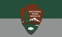 [National Park Service Flag with striped gray background]